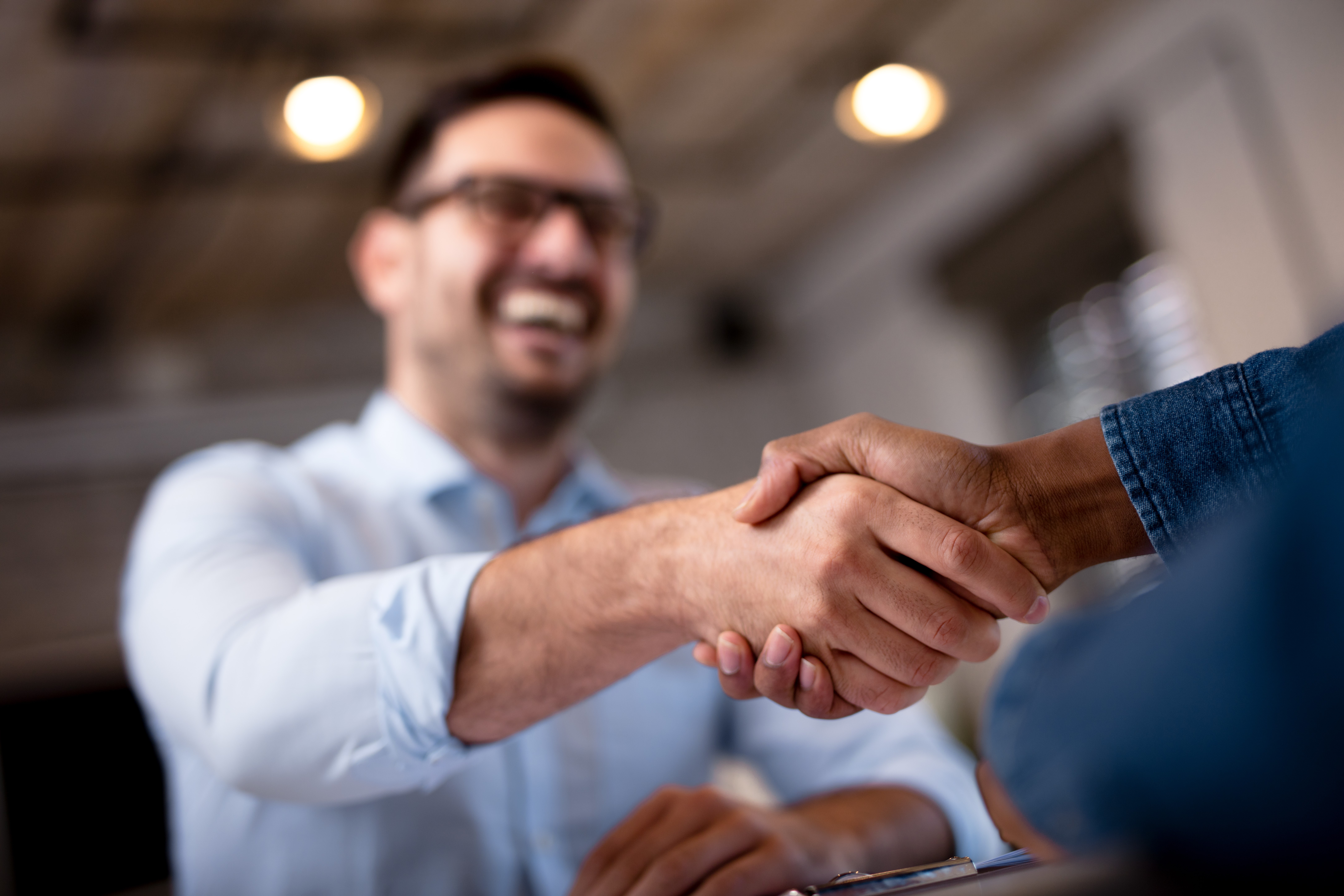 Man shaking hands with another